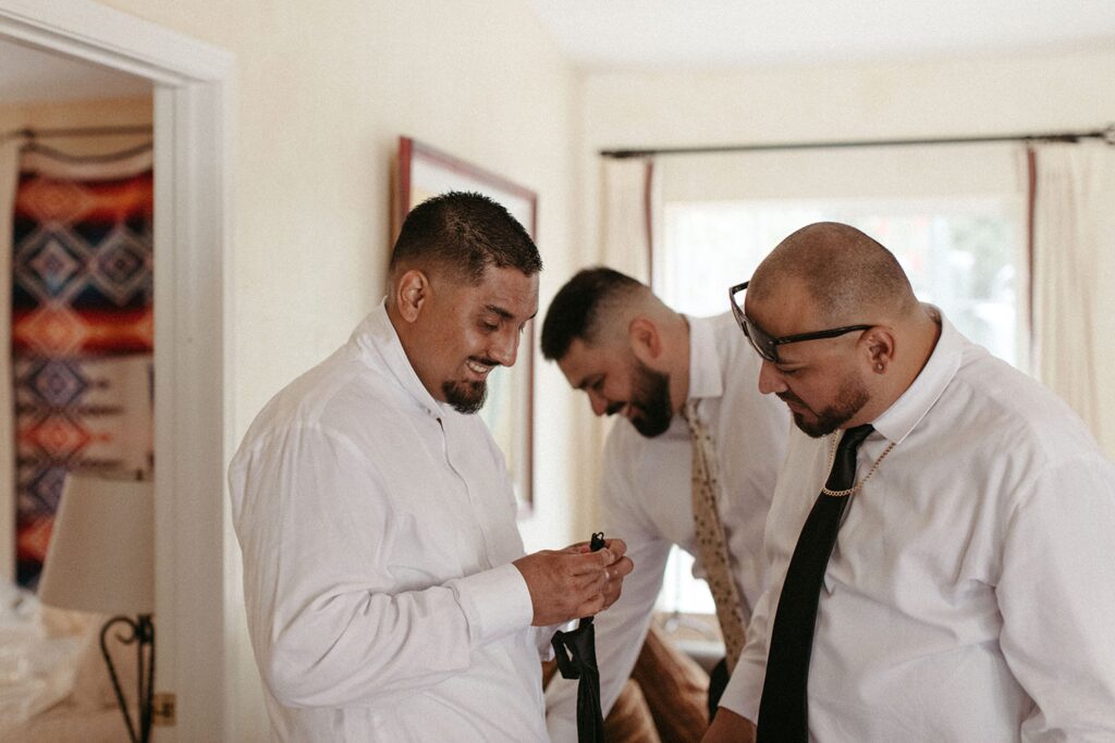 Groom getting ready on wedding day Photographed by Nicole Kirshner